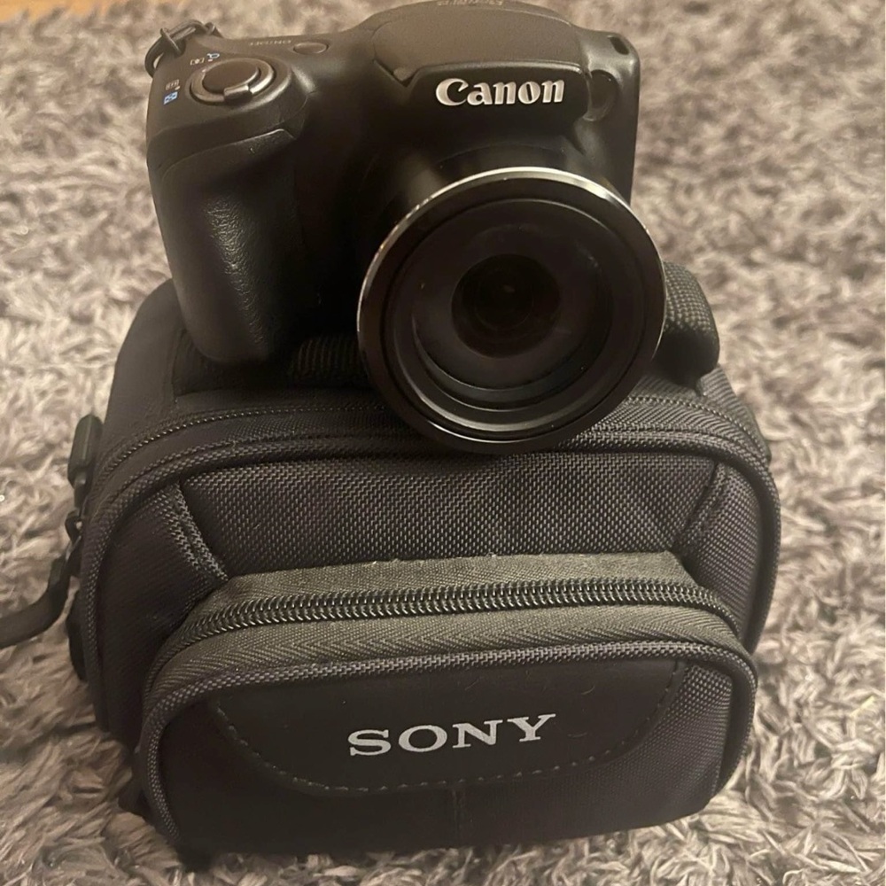 Canon Black Digital Camera with Sony Case